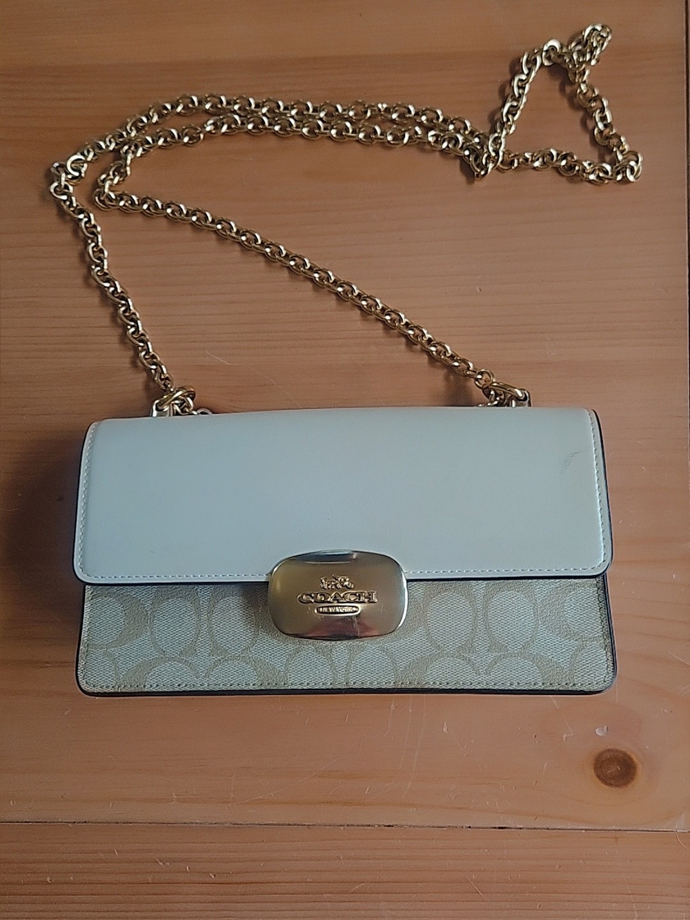 Coach Georgie Shoulder Bag In Signature Tan And Ivory Leather With A Gold Clasp.